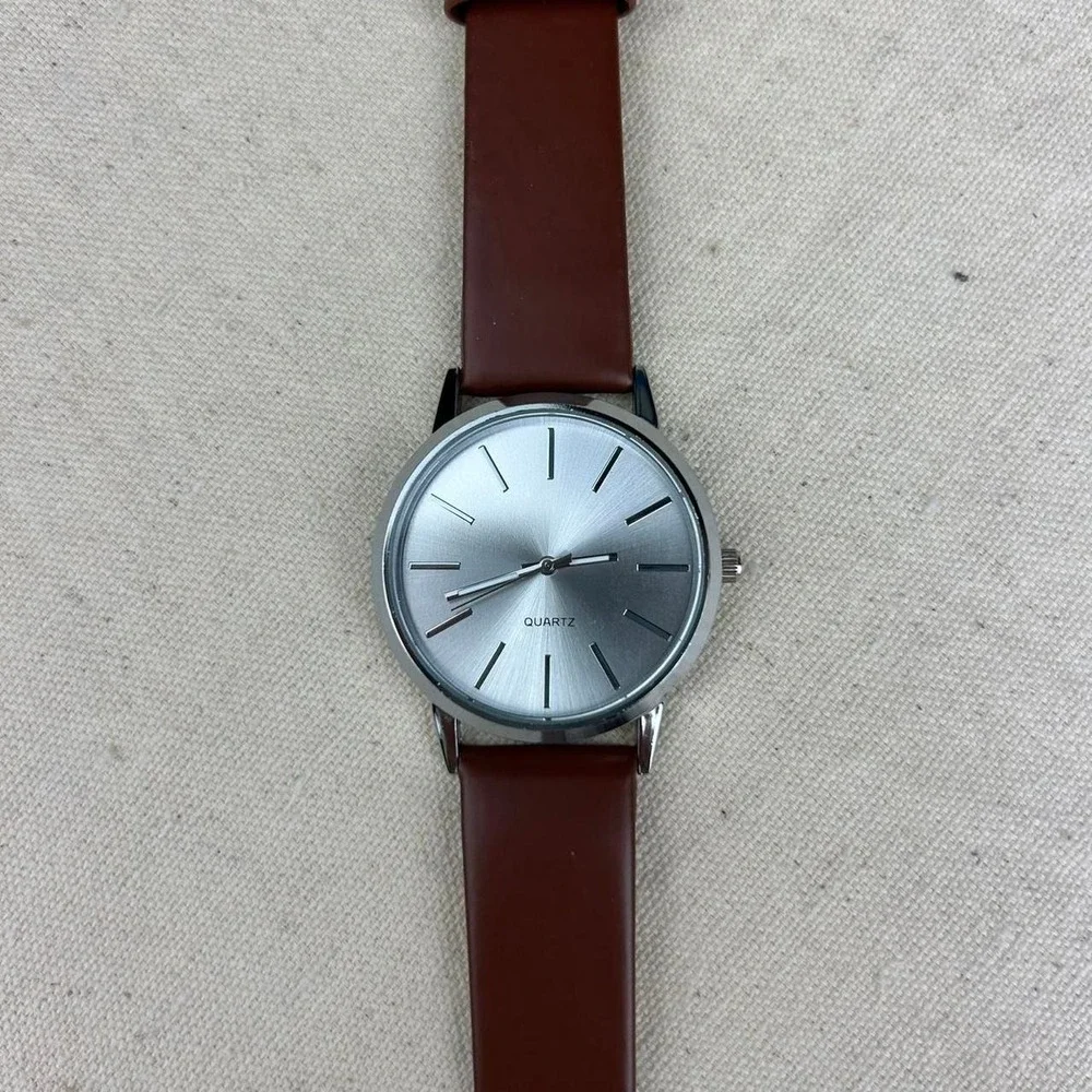Minimalistic essential vintage style watch stainless steel brown and silver